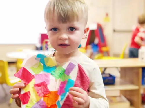 little boy and his art project at daycare